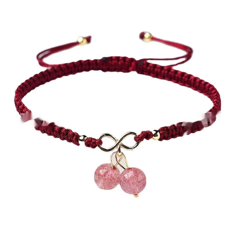 Women's natural strawberry quartz crystal cherry bracelet with adjustable cord on wrist