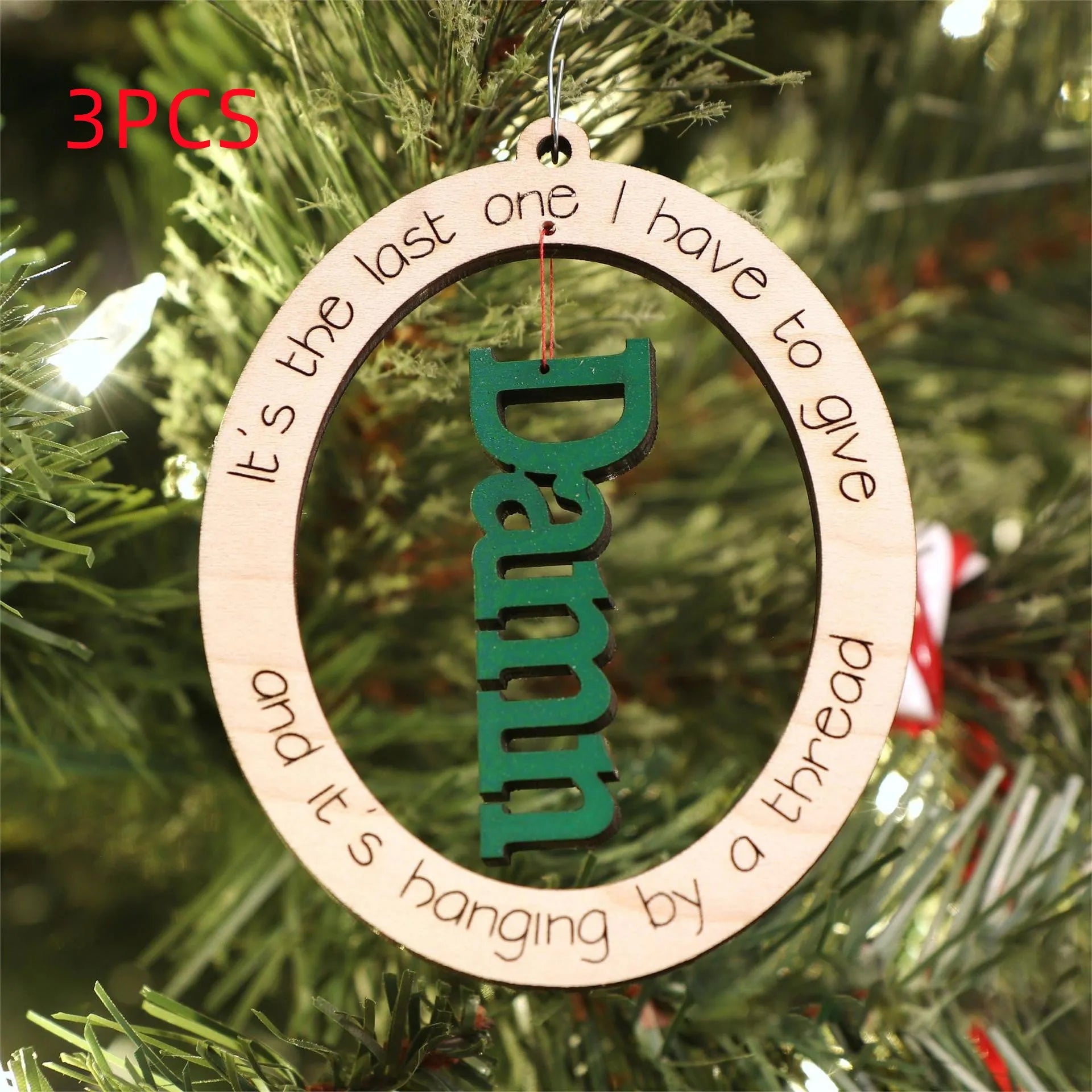 Basswood Christmas tree pendant in colour finish, 9.6x7.7cm, on a tree branch