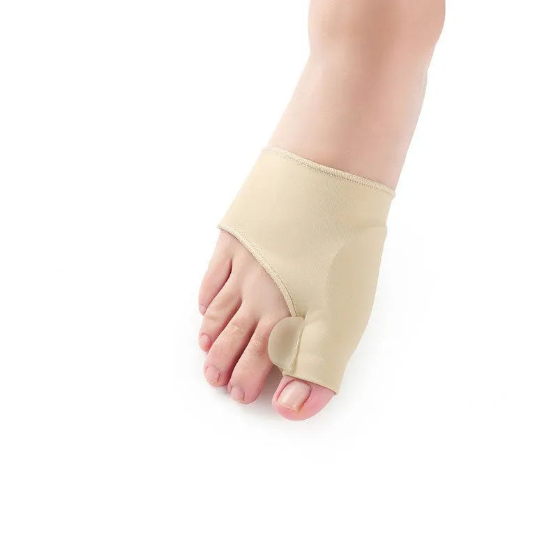 Corrective toe socks with a silicone gel bunion pad and toe separator on a grey background.