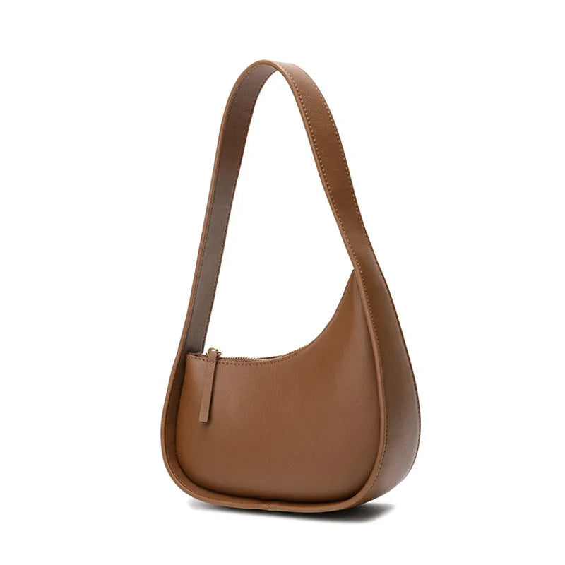 Genuine cowhide leather ladies handbag in half moon shape with wide shoulder strap