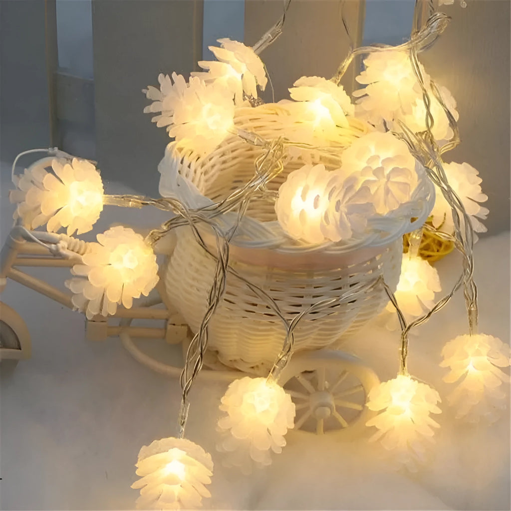 Warm white LED pine cone lights on a string, powered by batteries, for indoor and outdoor decoration.