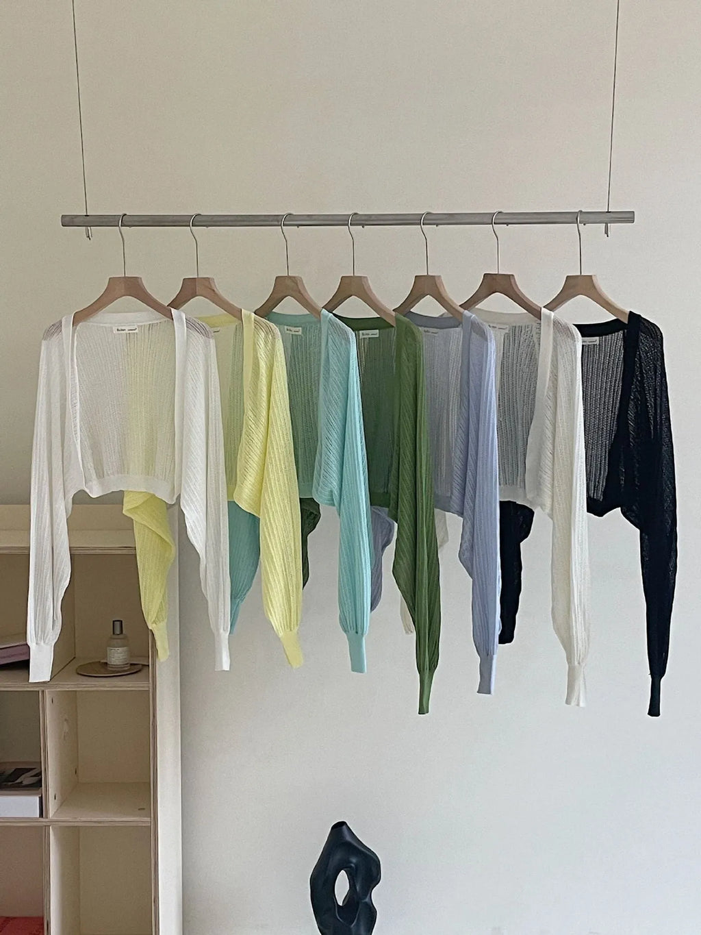 Women's hollow thin blouse with long lantern sleeves in linen-composition fabric, shown in apricot colour.