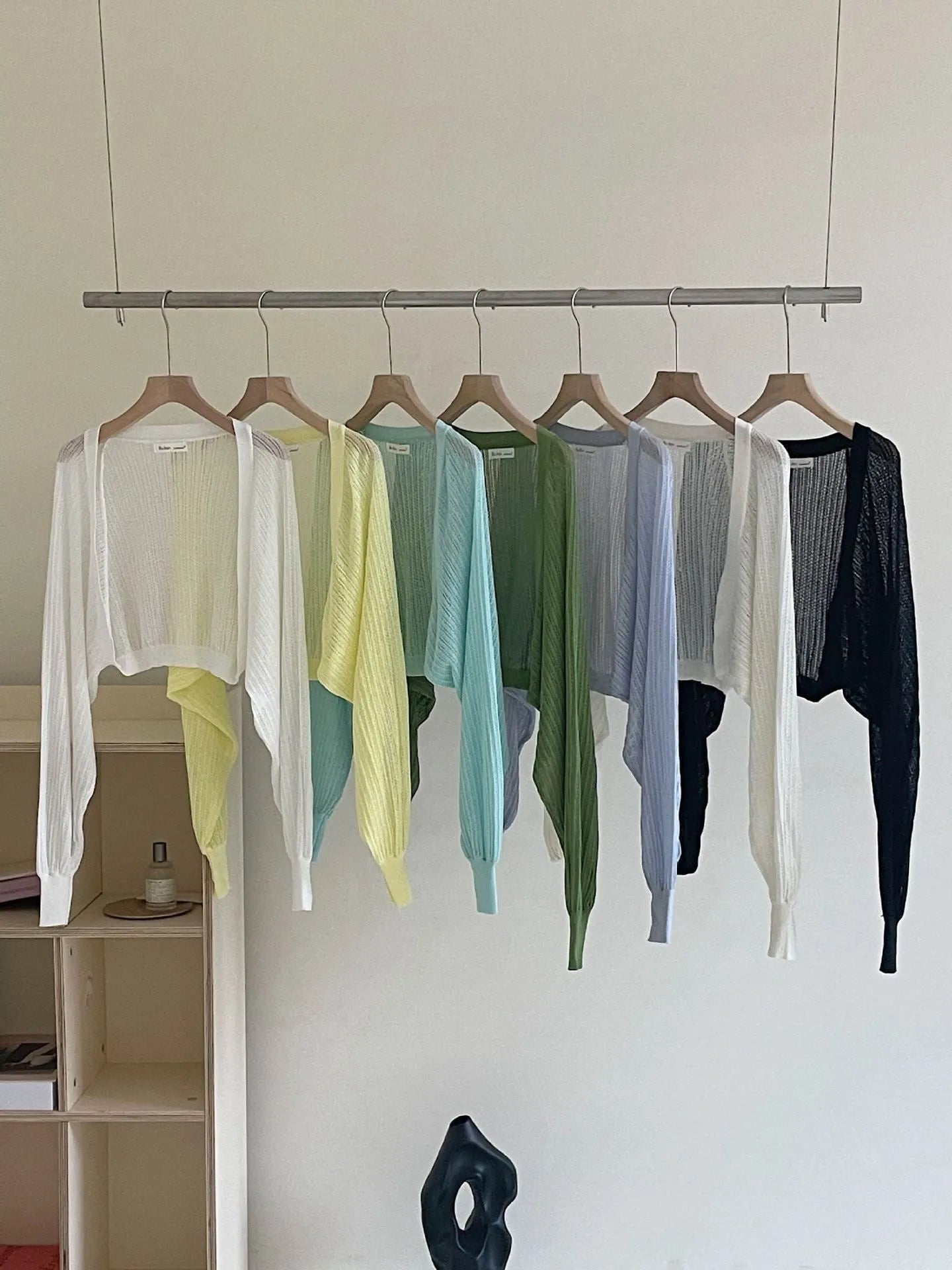 Women's hollow thin blouse with long lantern sleeves in linen-composition fabric, shown in apricot colour.