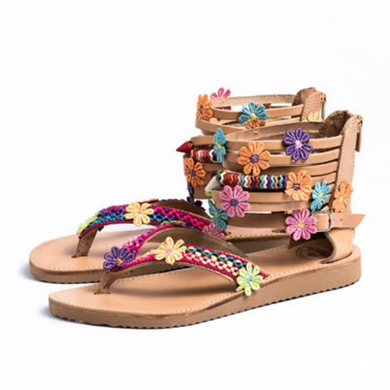 Women's ethnic Roman sandals with floral beaded petal details on a PU upper, round toe.