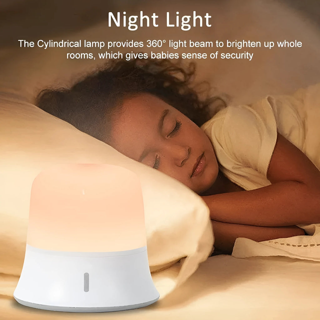 White bedside night light with touch controls for dimming and changing RGB colours on a table.