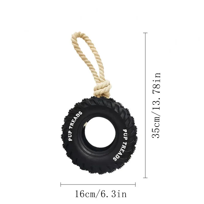 Dog chew toy with black rubber tyre and attached rope for interactive play