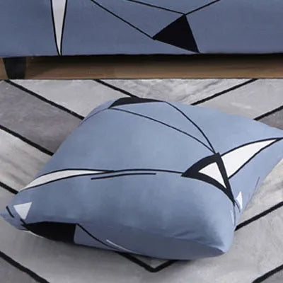 Geometric patterned stretch sofa slipcover on a double seat sofa with matching cushion