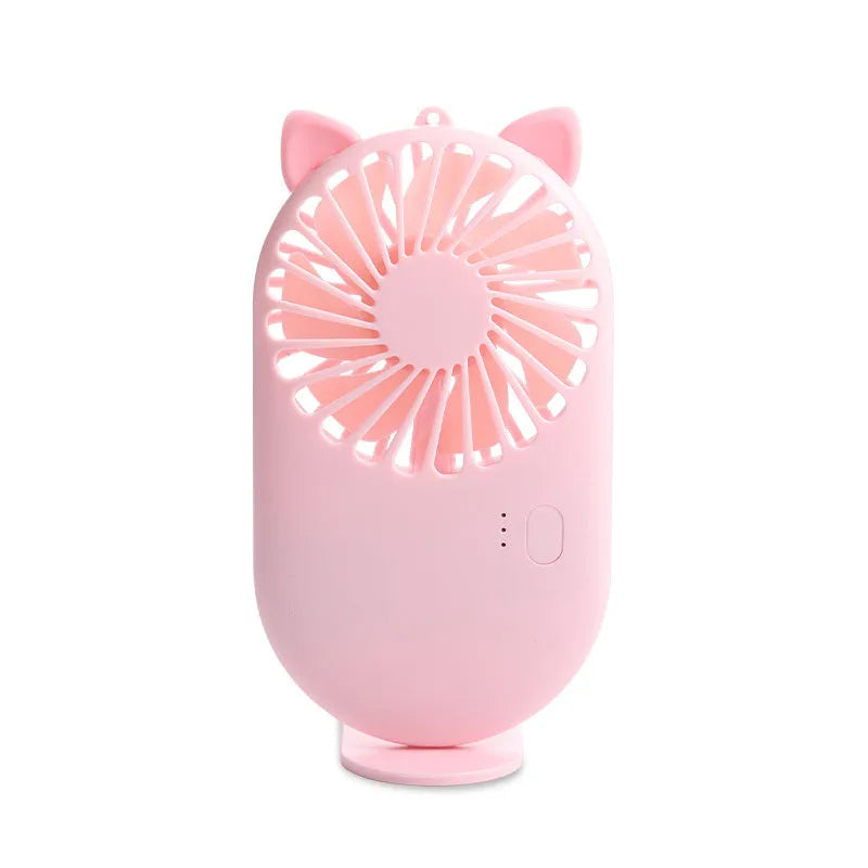 Blue portable USB rechargeable mini fan with three speed modes on a desk, plastic blade and piano switch visible