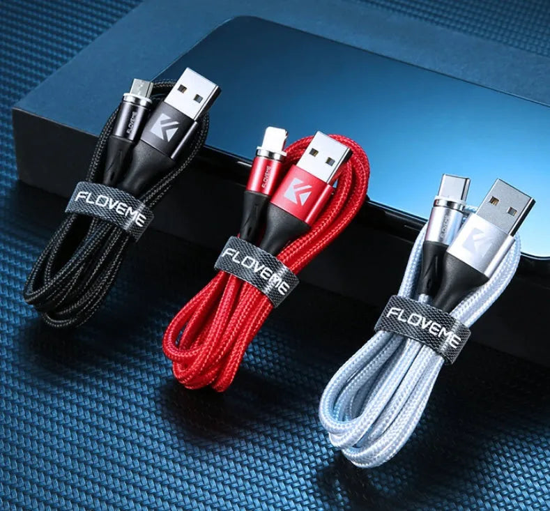 Black magnetic fast charge data cable with illuminated side lights and interchangeable connectors on a table.