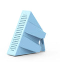 Mini black mobile phone amplifier bracket holding iPhone on desktop surface