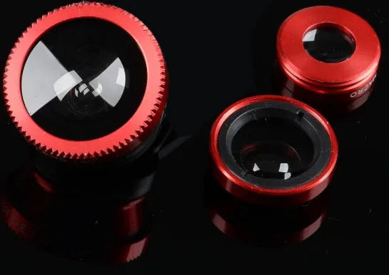 Three mobile phone camera lenses: fisheye, wide-angle, and macro, with attachment clip, in assorted colours