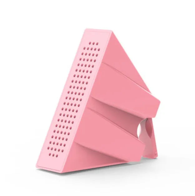 Compact black mobile phone amplifier stand holding an iPhone on a desktop.