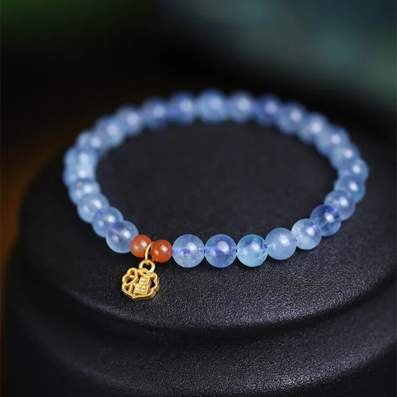 Women's ice translucent bracelet with 8mm crystal beads and a blessing card charm on a white background.