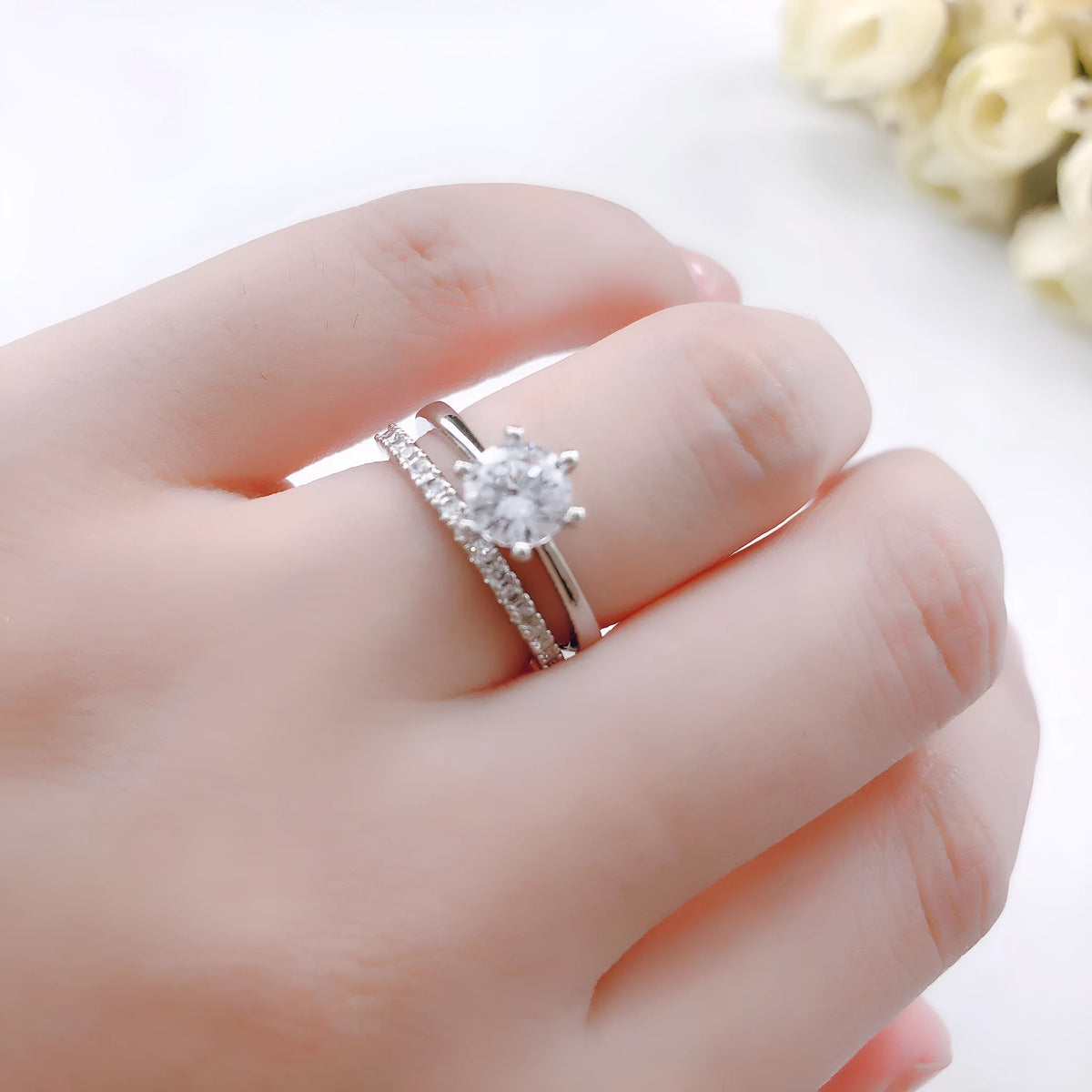 Gold plated copper ring set with two rings, each with a 6mm zircon stone in a six-claw setting, available in three colours.