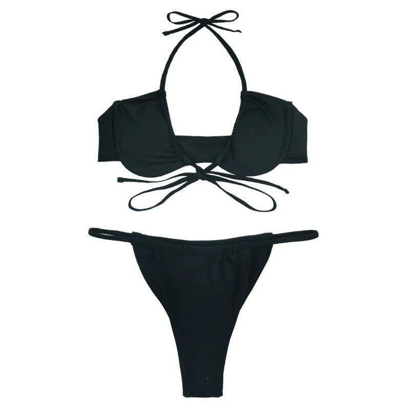 Women's black and mint green nylon bikini swimsuit set showing bra and briefs.