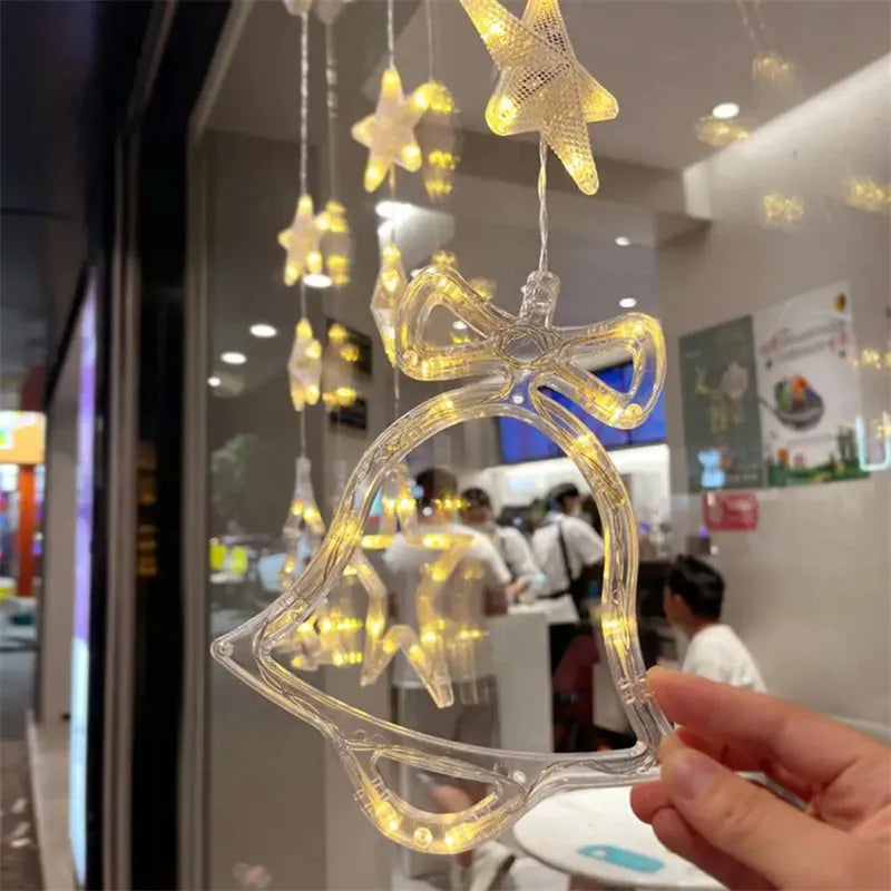 Set of three Christmas LED star window lights with suction cups on a glass window, warm glow, plastic housing, battery operated