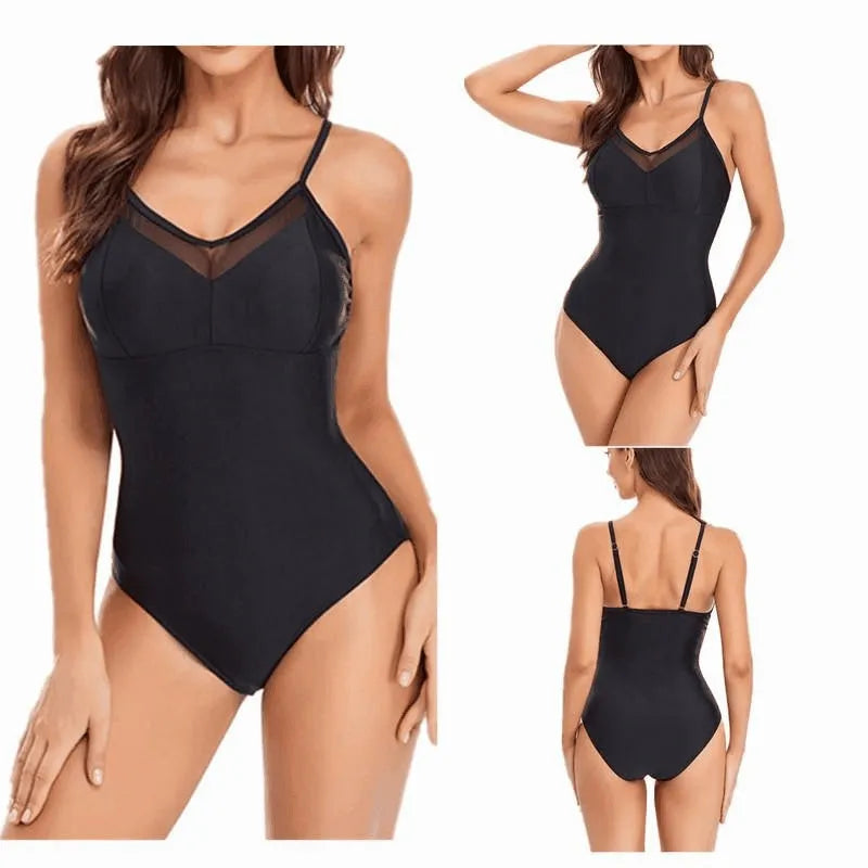 A black one-piece backless swimsuit with a mesh panel detail on a mannequin.