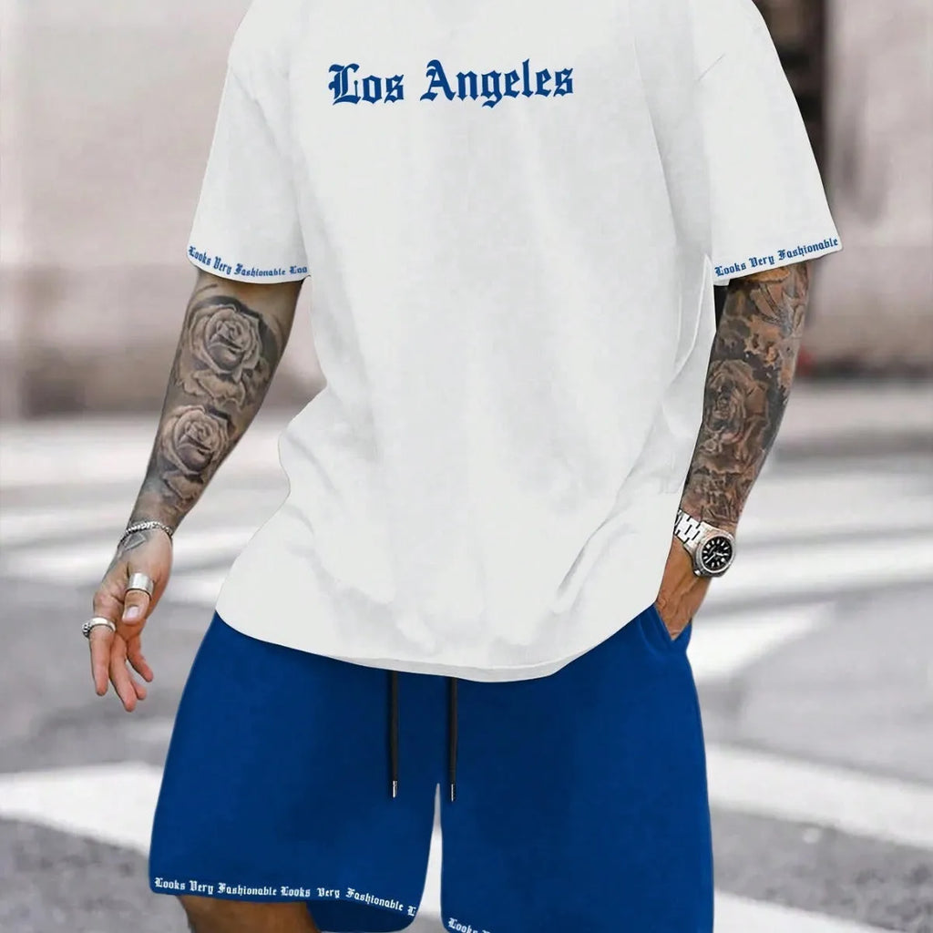 Man wearing a blue printed short-sleeve top and matching shorts from a quick-dry sports set.