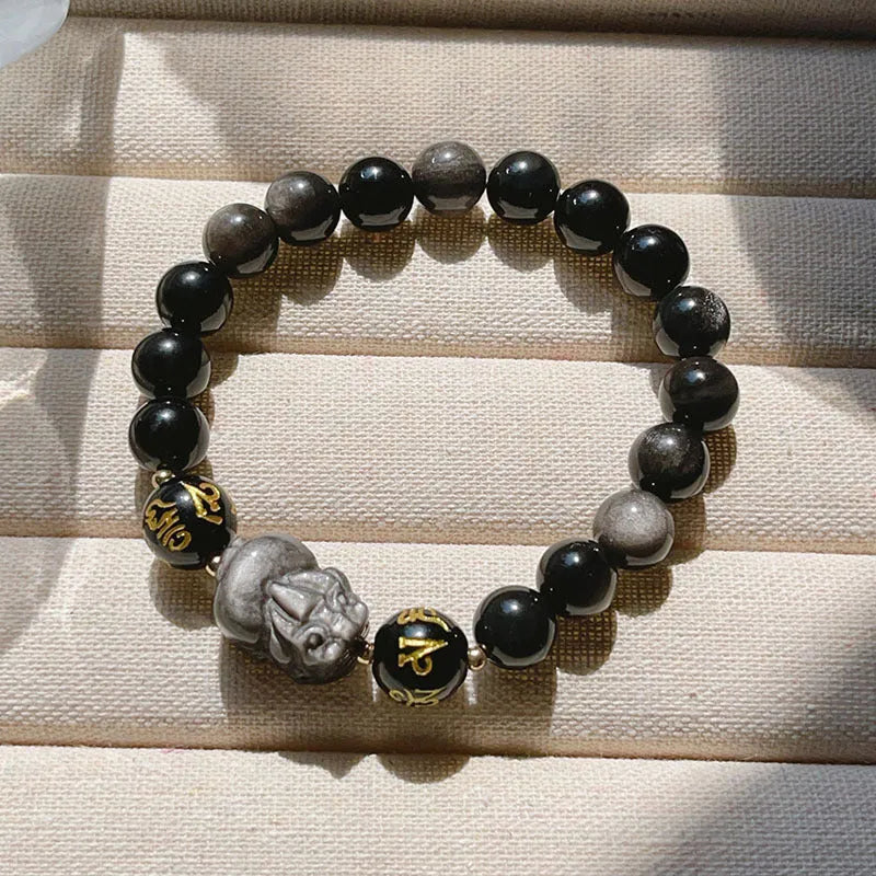 Men's silver stone beaded bracelet with Chinese style and engraved proverbs on a dark background.