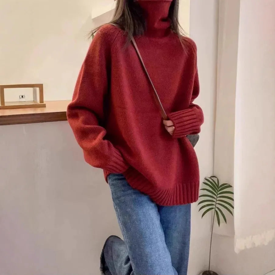 Women's loose thick turtleneck sweater in red with curling pile collar and textured mesh fabric