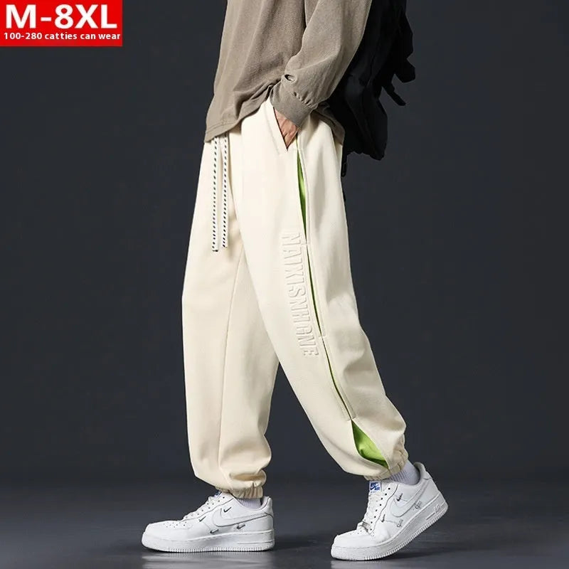 Men's black ankle banded trousers with stitching detail and cotton micro-elastic fabric