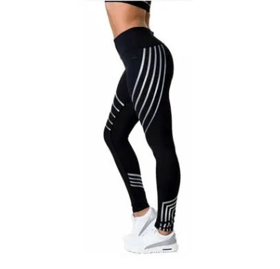 Women's black workout leggings with glowing print design and slim fit pencil pants silhouette