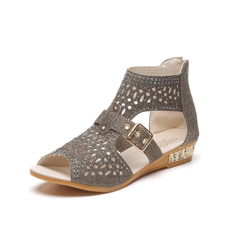 Women's beige flat sandals with back zipper and fish mouth toe on wedge heel.
