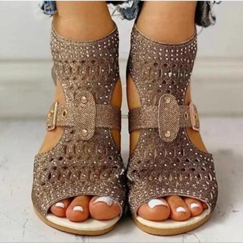Women's beige flat sandals with back zipper and fish mouth toe on wedge heel.