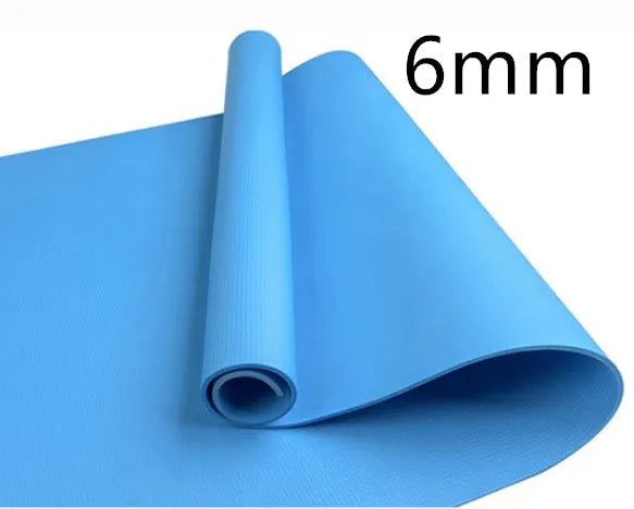 EVA foam yoga mat in blue, showing textured anti-slip surface, with a black OPP storage bag beside it.