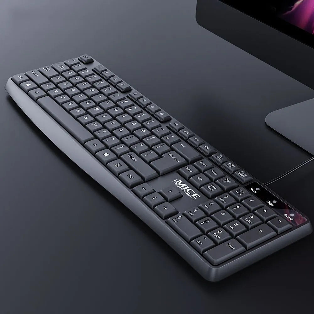 KM-520 black wired keyboard and mouse set with 104 keys and USB cables on a desk