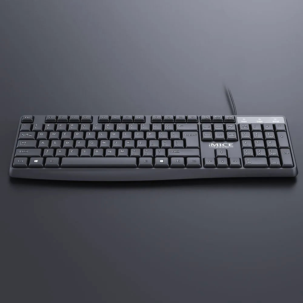KM-520 black wired keyboard and mouse set with 104 keys and USB cables on a desk