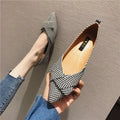 Women's red pointed toe flat shoes with a shallow V-neck opening and low flat heel.