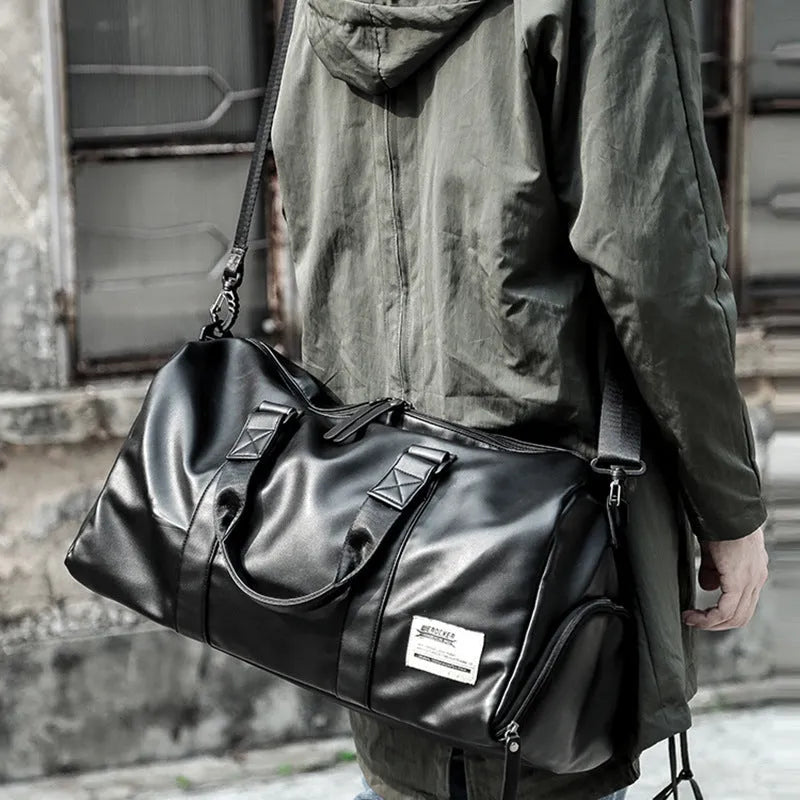 Black waterproof PU leather sports training bag with multiple organisational pockets
