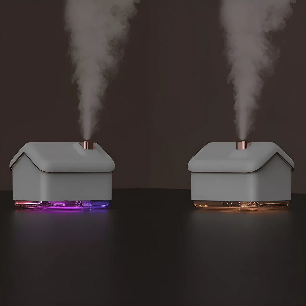 White igloo-shaped ultrasonic humidifier and essential oil diffuser with LED light on a wooden table