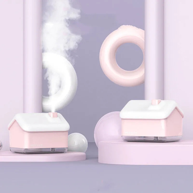 White igloo-shaped ultrasonic humidifier and essential oil diffuser with LED light on a wooden table