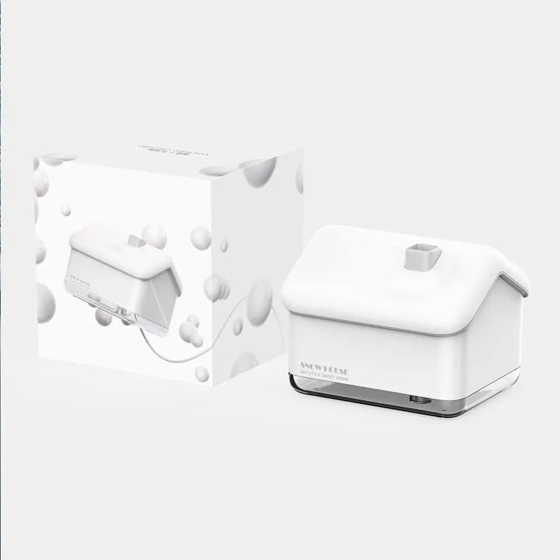 White igloo-shaped ultrasonic humidifier and essential oil diffuser with LED light on a wooden table