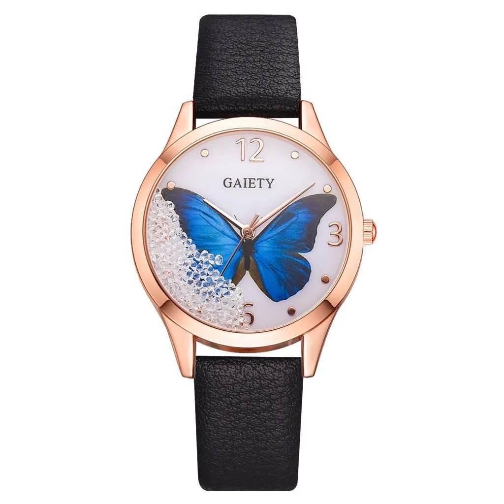 Gaiety ladies watch with removable rhinestone butterfly on a leather strap, showing a round silver dial.