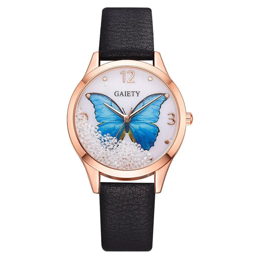 Gaiety ladies watch with removable rhinestone butterfly on a leather strap, showing a round silver dial.