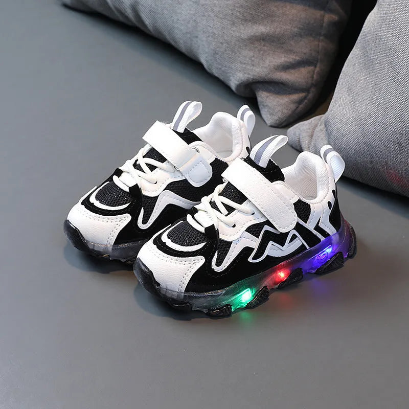 Kids black, pink, and grey breathable mesh Velcro sneakers with rubber soles.