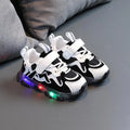 Kids black, pink, and grey breathable mesh Velcro sneakers with rubber soles.