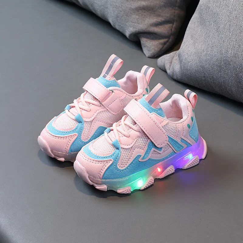 Kids black, pink, and grey breathable mesh Velcro sneakers with rubber soles.
