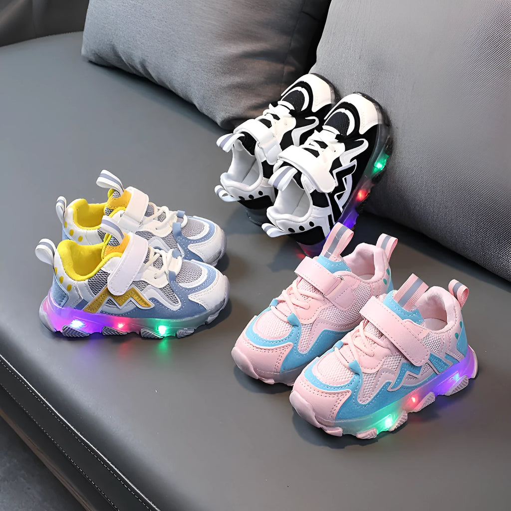 Kids black, pink, and grey breathable mesh Velcro sneakers with rubber soles.