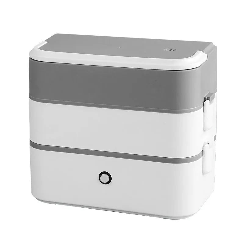 Double-layer portable heated lunch box with stainless steel liner showing push-button controls and power cord