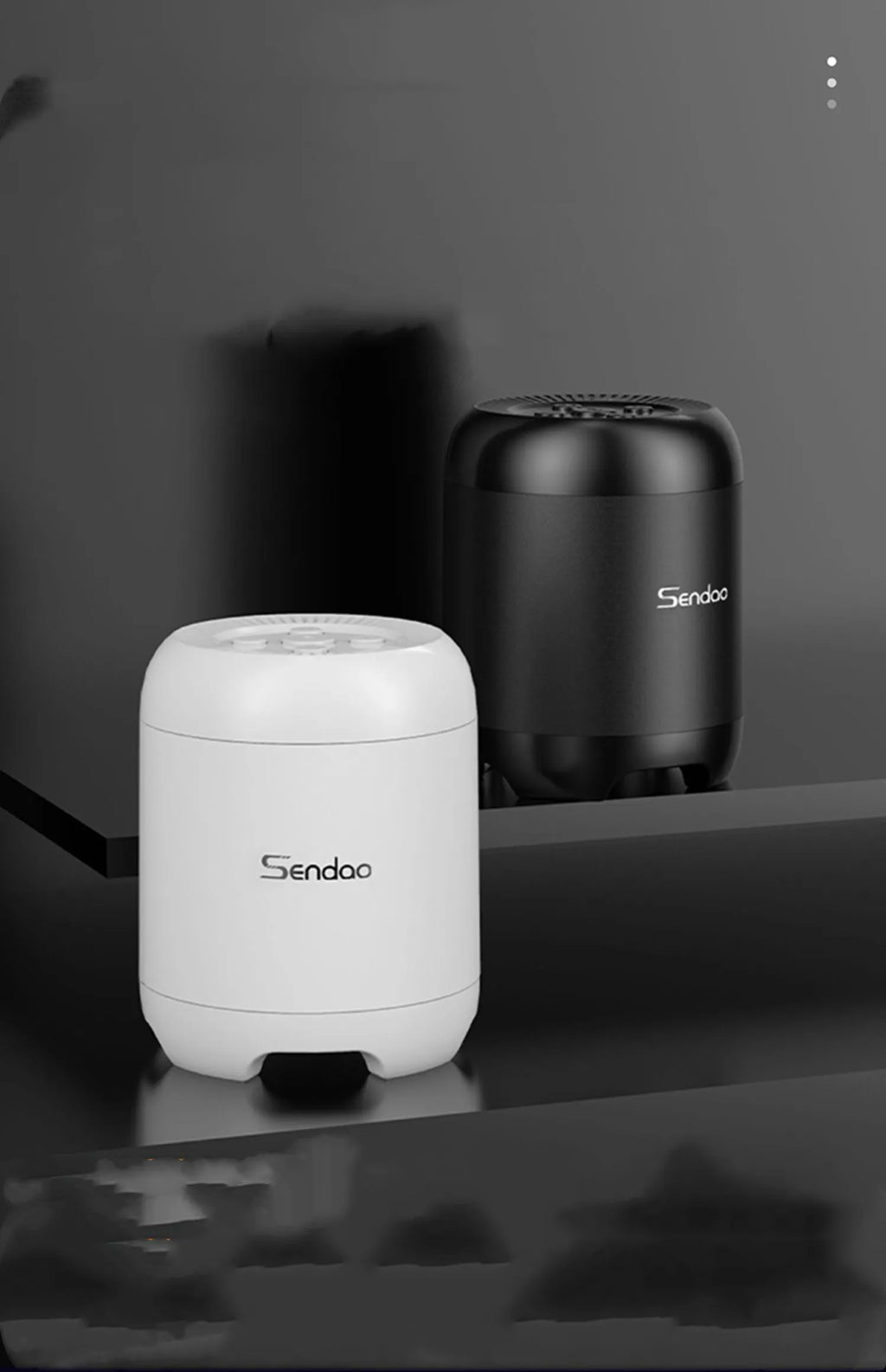 Small black or white portable Bluetooth speaker with card reader slot showing compact 90mm size.