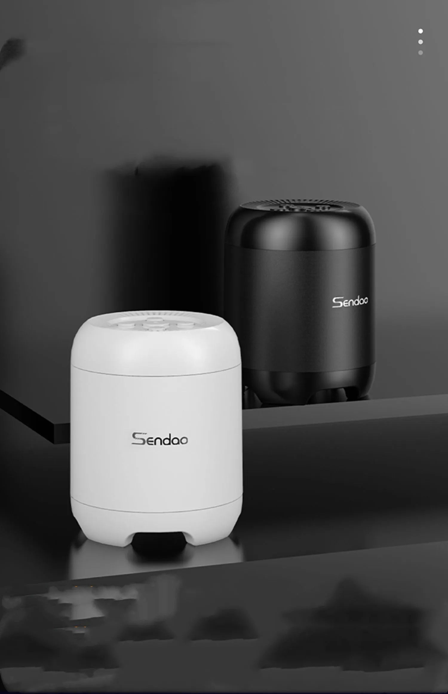 Small black or white portable Bluetooth speaker with card reader slot showing compact 90mm size.