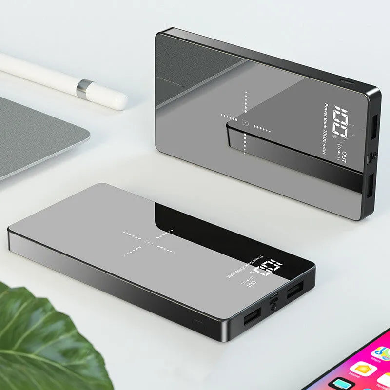 Black or white wireless power bank with 20000 mAh capacity, digital display, two USB outputs, size 73 mm x 153 mm x 22 mm.