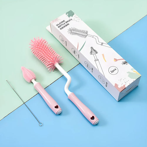 Baby bottle brush set with silicone bristles and a small straw cleaning brush in pink, blue, and yellow colours.