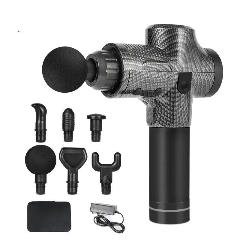 Black electric percussion massage gun with 7 different coloured attachment heads on a table.