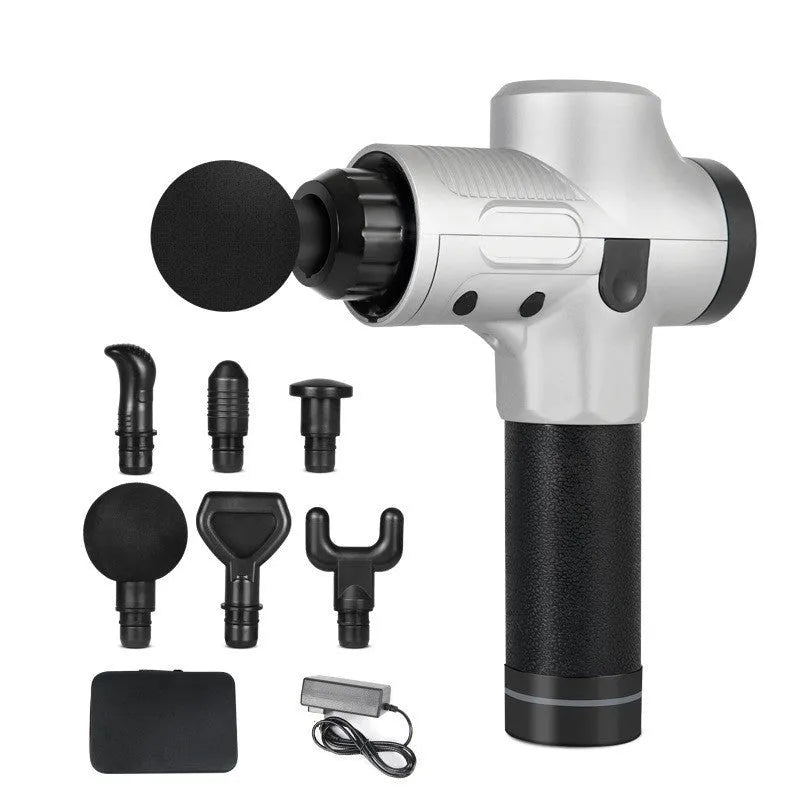 Black electric percussion massage gun with 7 different coloured attachment heads on a table.