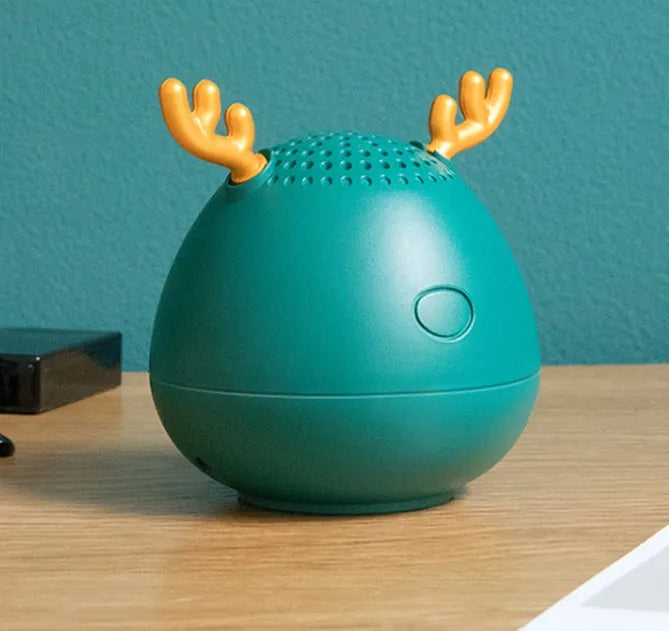Compact Bluetooth wireless speaker in green colour showing front view with USB charging port